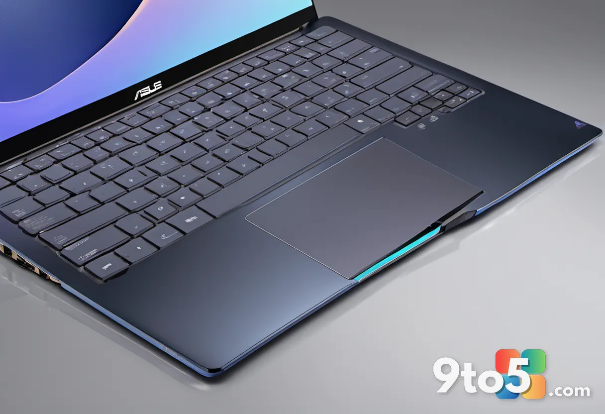 Close-up of the ASUS ZenBook 14's backlit keyboard and glass trackpad, highlighting the numeric keypad and slim profile.
